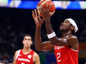 Shai Gilgeous-Alexander of Canada drives to the basket against the U.S. in the second quarter during the FIBA Basketball World Cup 3rd Place game at Mall of Asia Arena in Manila, Philippines, Sept. 10, 2023.