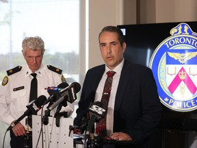 Toronto Police homicide Det.-Sgt Phillip Chapman, right, and Supt. Ron Taverner meet with the media at 23 Division on Monday June 24, 2024, about murder and attempted murder charges laid against a 14-year-old boy in relation to a June 2, 2024, shooting of five men in the parking lot at North Albion Collegiate. Two of the men died as a result of the shooting.