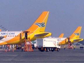 Cebu Pacific planes parked on the tarmac of Ninoy Aquino International Airport Terminal 3 in Manila.