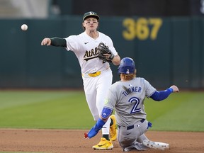 Zack Gelof of the Oakland Athletics completes the double-play on June 7, 2024 at the Oakland Coliseum in Oakland, California.