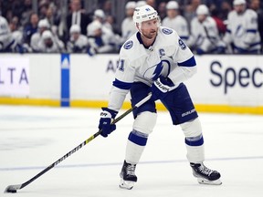 Tampa Bay Lightning centre Steven Stamkos moves the puck during the third period of an NHL hockey game against the Los Angeles Kings, March 23, 2024, in Los Angeles.