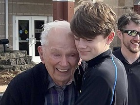 This photo provided by Linda Mitchelle shows Orville Allen of Poplar Bluff, Mo., hugging his great-grandson in March 2024.