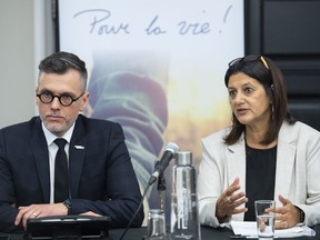 Quebec's chief coroner has called an inquest into the death of a quadriplegic man who requested medical assistance in dying after developing severe bedsores during a hospital stay. Coroners Gehane Kamel, right, and Dave Kimpton speak during a news conference in Montreal, Thursday, May 19, 2022.