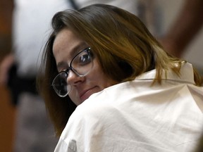 Defendant Alexandra Eckersley looks back to her family sitting behind her during her trial at Hillsborough County Superior Court.