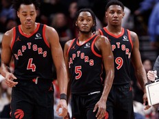 Scottie Barnes (4), Immanuel Quickley (5) and RJ Barrett (9) listen in during the second half of their NBA game against the Boston Celtics at Scotiabank Arena on Jan. 15, 2024, in Toronto.