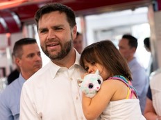 Republican vice presidential nominee U.S. Sen. J.D. Vance (R-OH) carries his daughter Maribel Vance as he arrives to greet supporters at the Park Diner on July 28, 2024 in St Cloud, Minnesota.