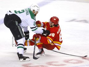 Calgary Flames Andrew Mangiapane battles Dallas Stars Jani Hakanpaa last season.