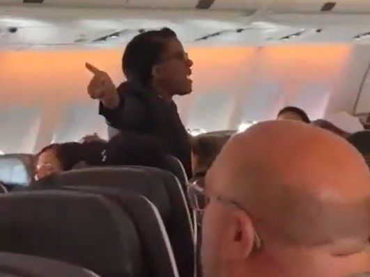 Screenshot of Air Canada flight attendant losing it on passenger.