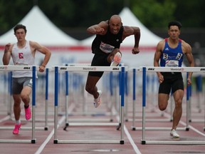 Andre De Grasse and Damian Warner will defend their Olympic titles at this summer's Paris Games as part of Canada's athletics team. Warner competes in the semifinal 100m hurdles at the Canadian Track and Field Olympic trials in Montreal, Saturday, June 29, 2024.