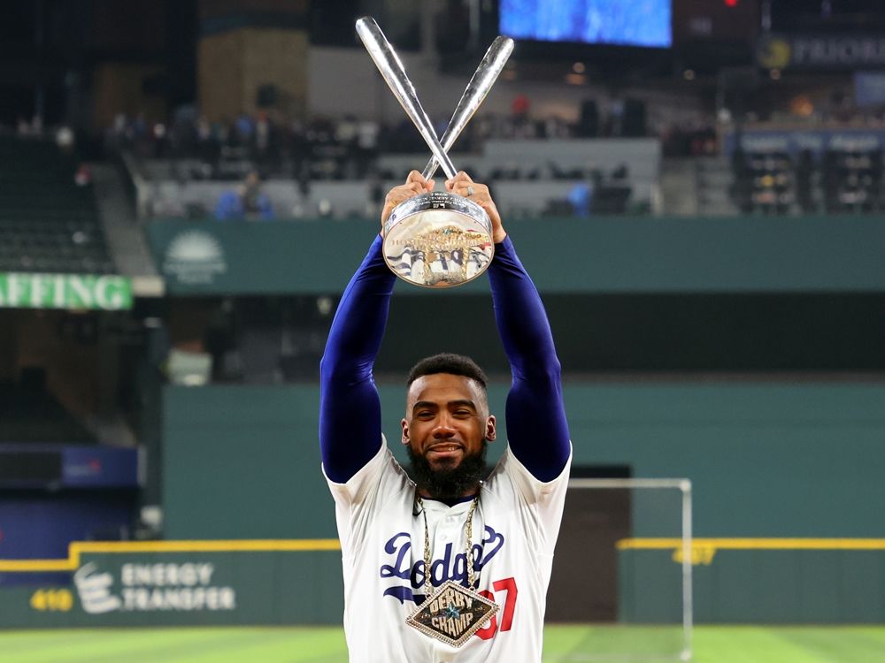 Teoscar Hernández of the Los Angeles Dodgers poses with the trophy after winning the T-Mobile Home Run Derby at Globe Life Field on July 15, 2024 in Arlington, Texas.
