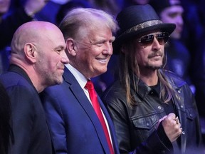 UFC president Dana White, left, and Kid Rock, right, pose for photographs with former President Donald Trump at UFC 295 on Saturday, Nov. 11, 2023, in New York.