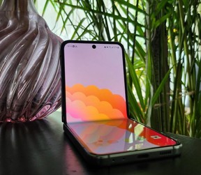 The Galaxy Z Flip5 perched on a flat surface