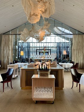 AIRA's dining room, designed to emulate the flow of the water through its large windows.