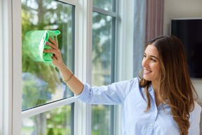 Melissa Maker using her signature Marker's Clean microfiber cloth to clean windows.
