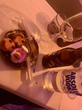 A foie gras torchon with rose hip coulis, served with a French dessert wine in a syringe at Punk Royale.