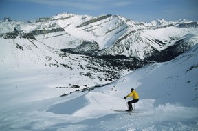 Skiing with a view of the Rocky Mountains in Sunshine Village, AB.