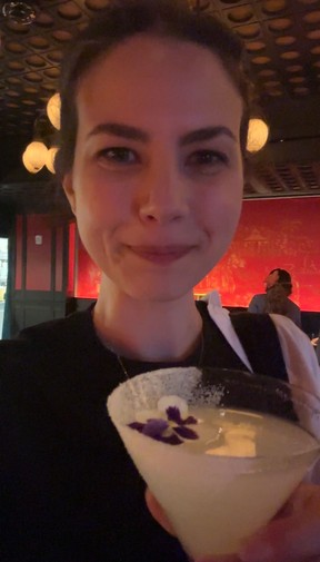 Enjoying the first sip of a delicious cocktail at House of the Red Pearl.