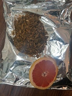 The results. That's what one entire bucket full of food scraps became. The grapefruit is there for size reference. Clearly, it reduced my waste by a lot.