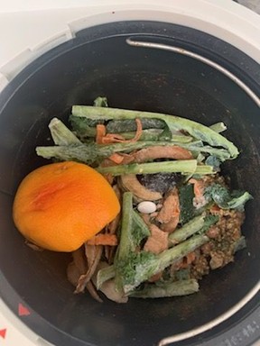 Compost material plus a LomiPod because it's being run in 'grow mode' so I can add the results to my plant pots.