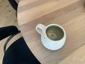 Admiring the table grain while enjoying a matcha.