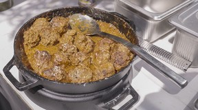 The newest Ooni can now handle even large, cast-iron pans.