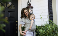 Woman holding baby in a Boba Wrap Baby Carrier
