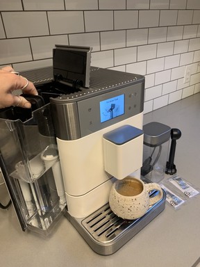 The fully-automatic machine letting me know it's time to fill the water tank.