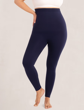 woman wears navy shapermint Essentials High Waisted Shaping Leggings