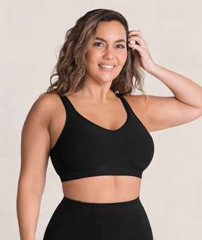 woman wears black Shapermint Essentials Everyday Comfort Straps Wireless Shaping Bra