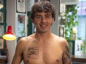 Mark McMorris wearing his new "Skin+Dorsement" deal inked on his chest.
