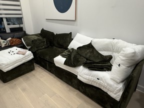 Putting the slipcovers on the Gaia sofa.