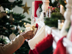 Christmas stockings are hanging by the chimney - stock photo