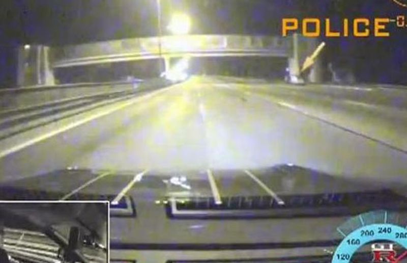 A dashboard camera records a speeder’s encounter with police. (Source: autoblog)