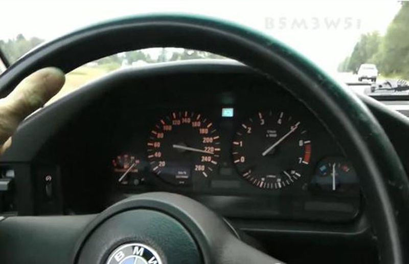 230 km/h in an old BMW – with one hand on the wheel and another hand struggling to keep the camera steady. (Screen shot/YouTube)