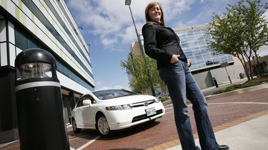 Chantal Dupasquier of Winnipeg poses with her Honda hybrid.