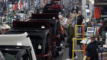 Chrysler assembly workers work on 2009 Jeep Wranglers at the Toledo Supplier Park Jeep plant in Toledo, Ohio.
