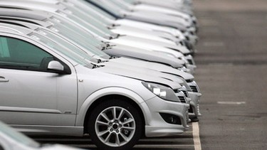 Vauxhall motor cars sit in the distribution yard at the company's manufacturing plant on February 18, 2009 in Ellesmere Port, England. Vauxhall's parent company General Motors and Chrysler are are seeking a further USD $21.6 billion in aid as they release plans to cut 50,000 jobs.