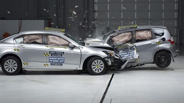 A 2009 Honda Accord and 2009 Honda Fit in frontal offset car-to-car IIHS crash test.