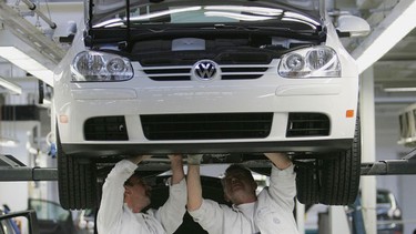 Workers assemble Golf cars at the production line at the Volkswagen factory in Wolfsburg, Germany in this file photo.