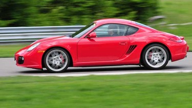 Derek McNaughton steers a 2009 Porsche Cayman S around the track at Calabogie Motorsports Park as part of a Mark Motors of Ottawa customer driving event.