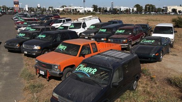 Cars traded in for the Cash For Clunkers program sit in a storage lot August 26, 2009 in Fairfield, California. The US Transportation Department said the Cash for Clunkers program yielded just under 700,000 new car sales during the month-long program. 690,114 vouchers totaling $2.88 billion were submitted by new car dealers.