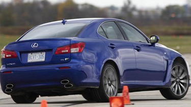 A Lexus IS F, the winning car in the performance (over $50,000) category, winds its way through the cones.