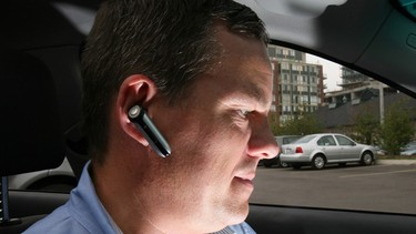 Peter Vass uses his bluetooth device in this file photo.