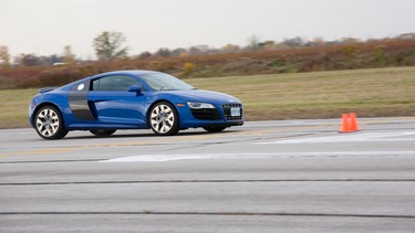 A Sepang Blue Audi R8 5.2 FSI at speed on the handling evaluation course during Day 1 of TestFest 2010
