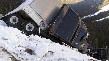 A truck is over the edge of the North Cascades Highway in Washington. While the North Cascades Highway was closed for the winter, the History Channel took the opportunity to film a truck going over the edge of the highway for one of their episodes of Ice Road Truckers.