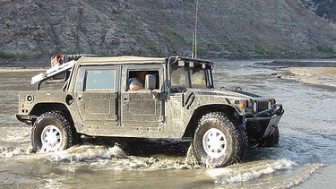Hummer crosses the river in Azusa near Los Angeles.