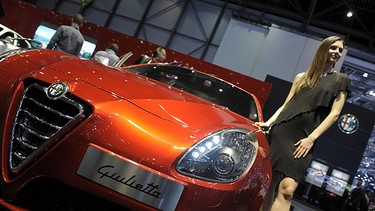 A models present the new Giulietta of the Italian carmaker Alfa Romeo on March 2, 2010 during the second press day at the 80th Geneva International Motor Show at Palexpo in Geneva.