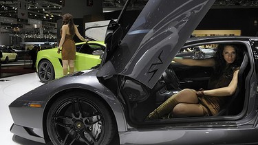 A model presents a new model of Italian carmaker Lamborghini on March 3, 2010 during the third press day at the 80th Geneva International Motor Show at Palexpo in Geneva, Switzerland.