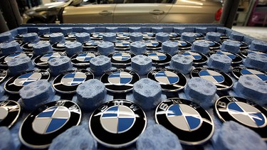 BMW logos are pictured in a tray on on the BMW 3-series production line at the BMW factory on March 15, 2010 in Munich, Germany.