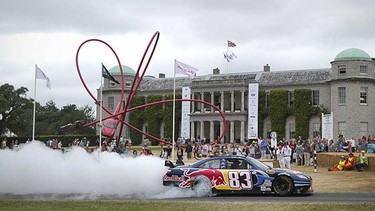 A NASCAR racing car performs a wheelspin in front of Goodwood House during the Goodwood Festival of Speed in West Sussex, England on July 04, 2010.